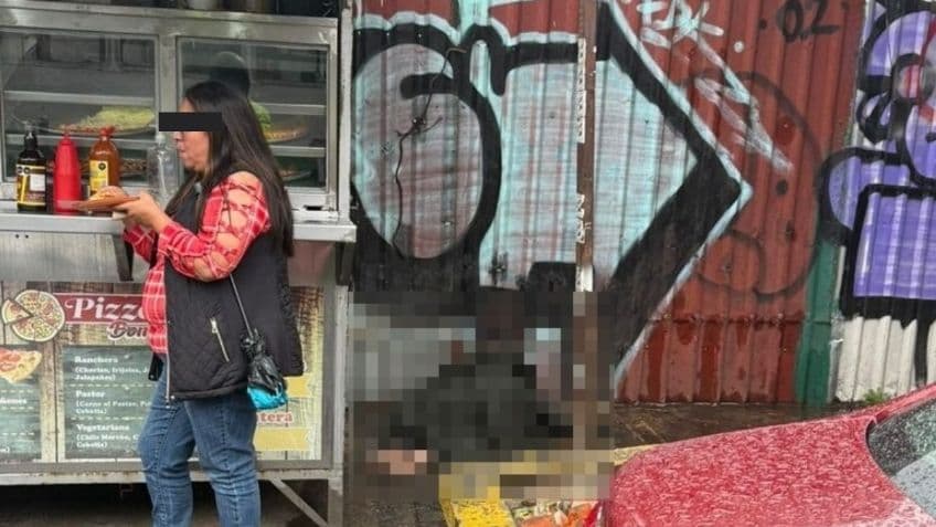 Genera debate fotografía de mujer comiendo pizza enfrente de cadáver